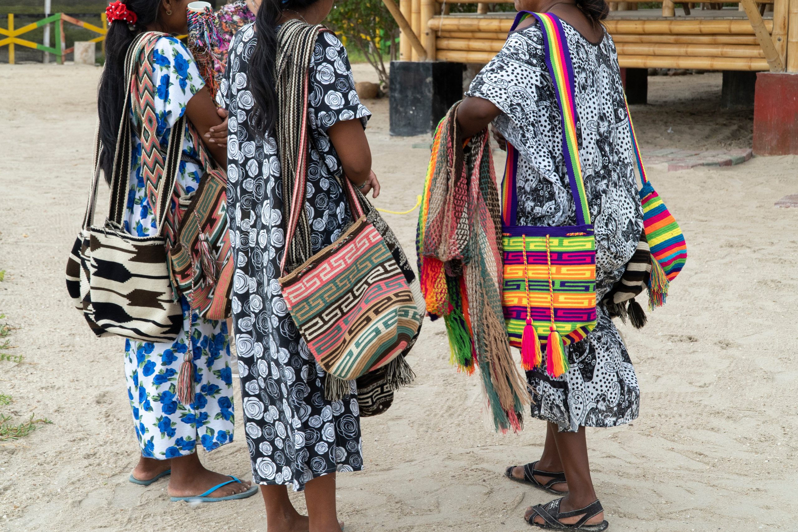 Riohacha, Guajira, Colombia. May 10, 2019: Women holding handicrafts in La boquita